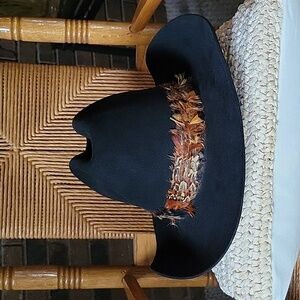 New West by Baileys, black western/cowboy hat with feather trim. 7- 1/8 size